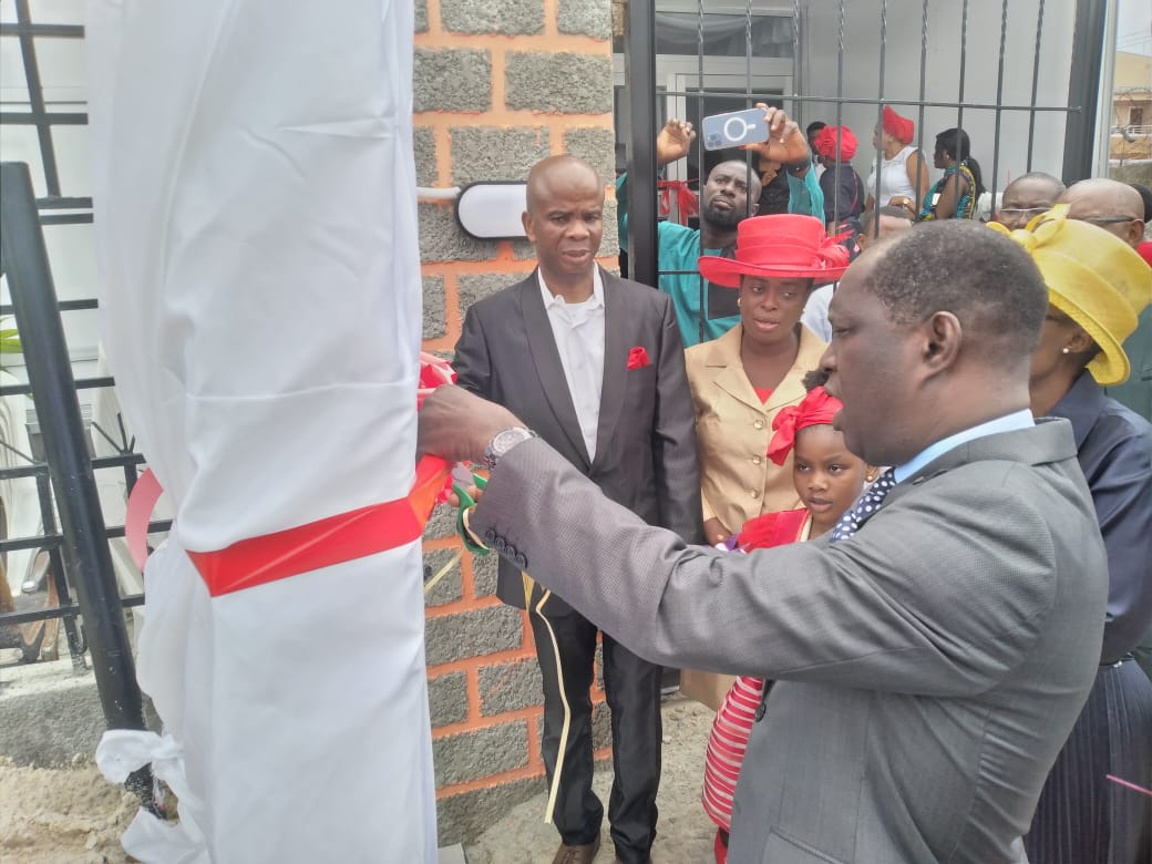 Pastor Biyi unveiling Reinging King Parish