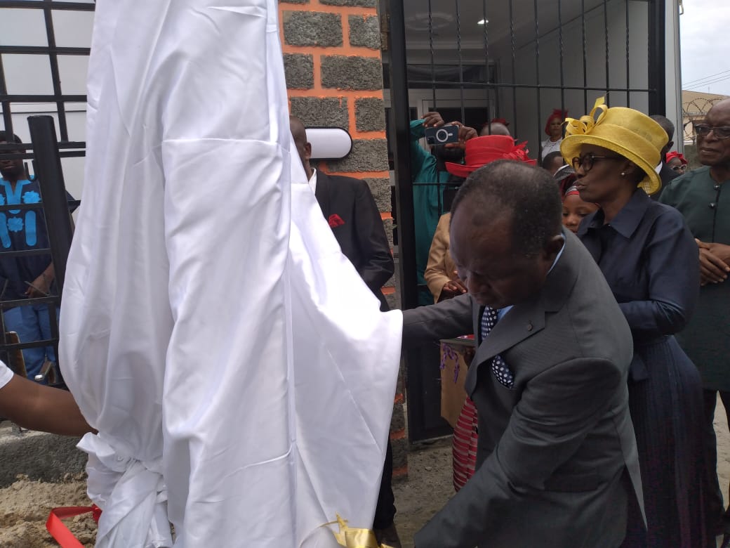 Pastor Biyi unveiling Reinging King Parish