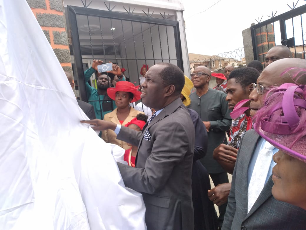 Pastor Biyi unveiling Reinging King Parish